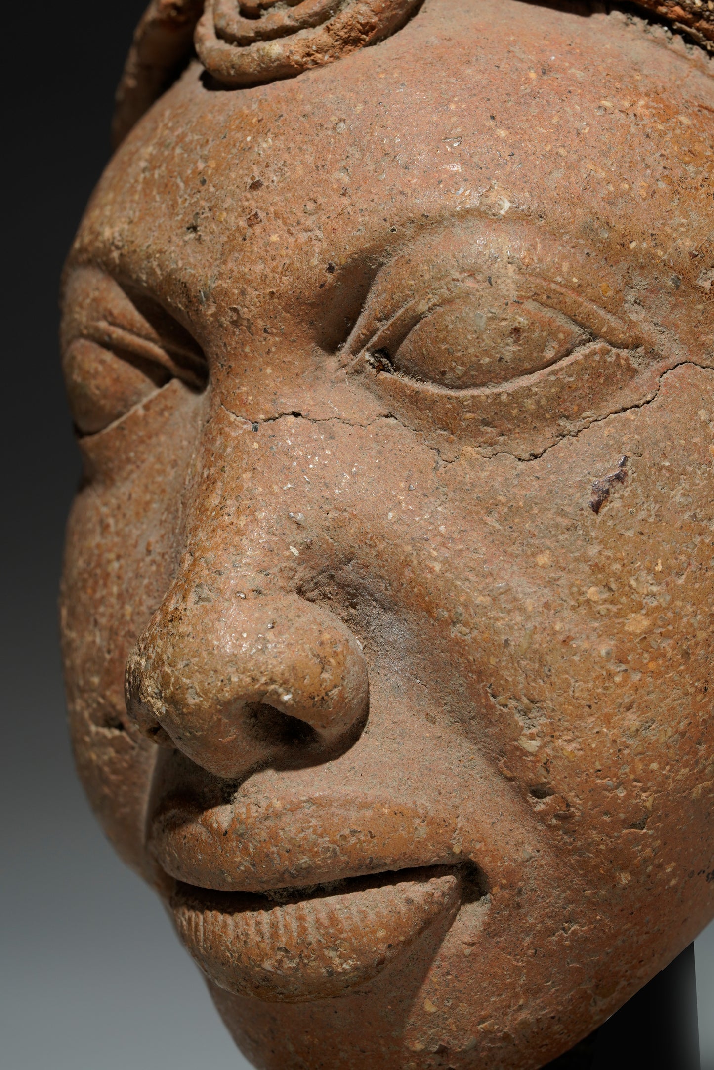 An amazing fragmentary terracotta head in the style of Ife