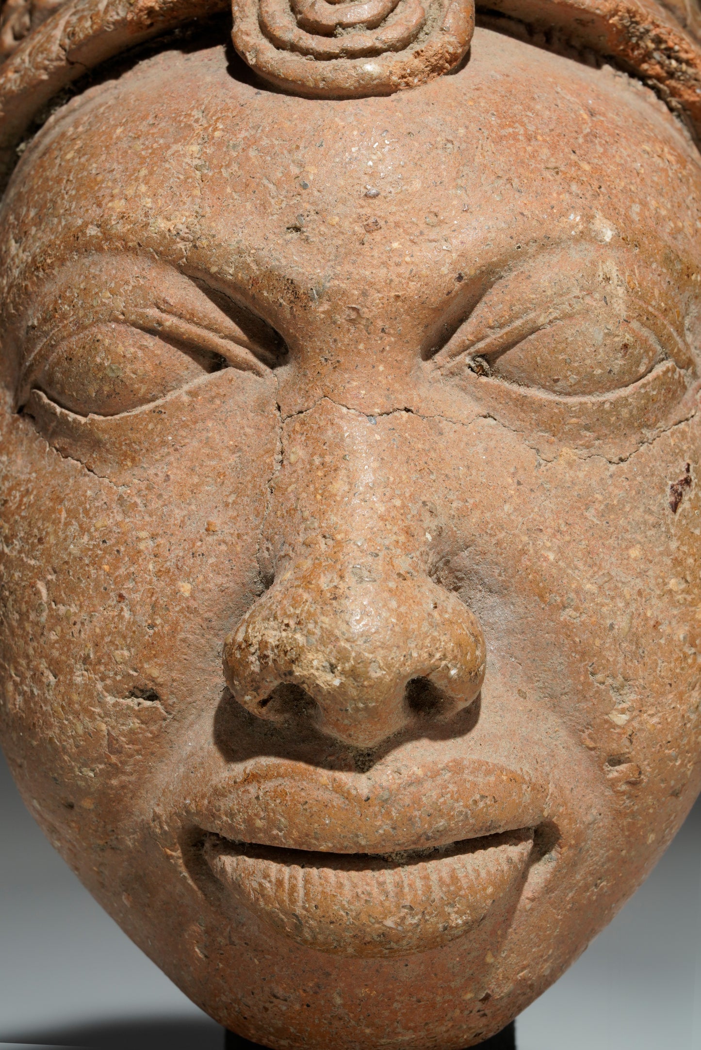 An amazing fragmentary terracotta head in the style of Ife