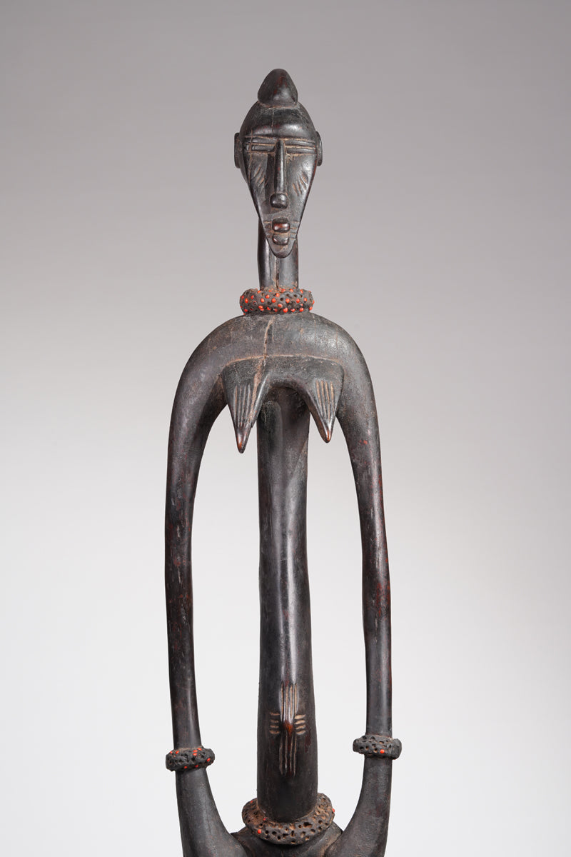 An outstanding female Senufo Rhythm pounder