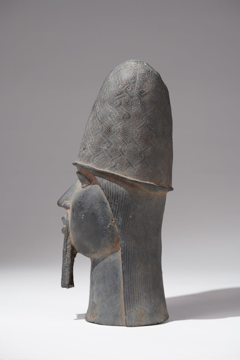 A Bronze head of a Portuguese in the style of Benin