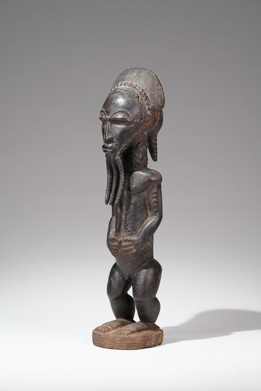 A male Baule, Blolo Bian sculpture