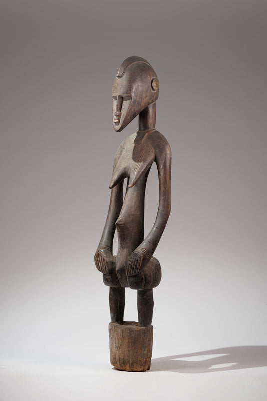 A female Senufo Rhythm pounder - called Débéle