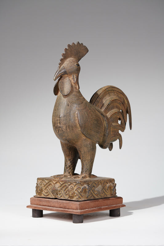 A brass rooster in the style of Benin