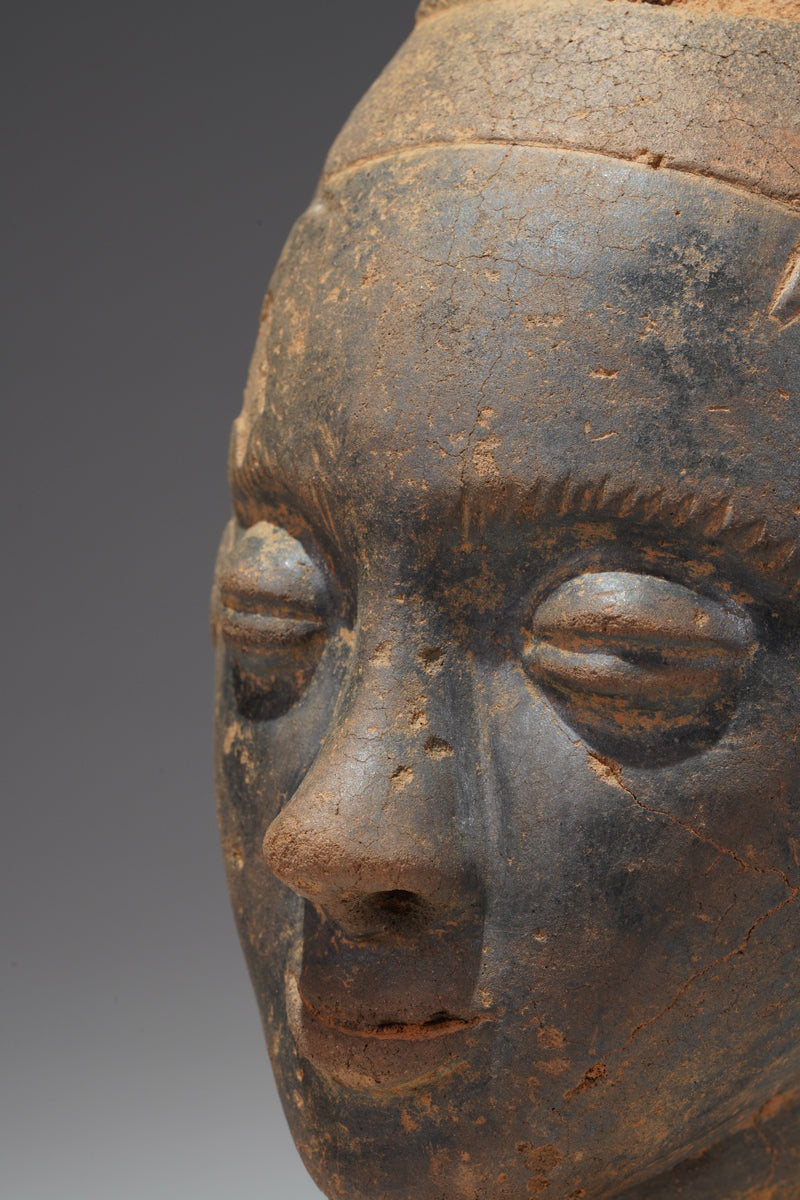 A fragmentary Akan terracotta funeral head