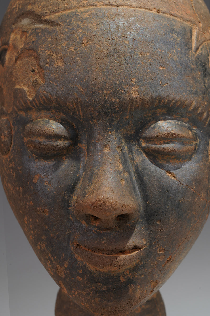 A fragmentary Akan terracotta funeral head