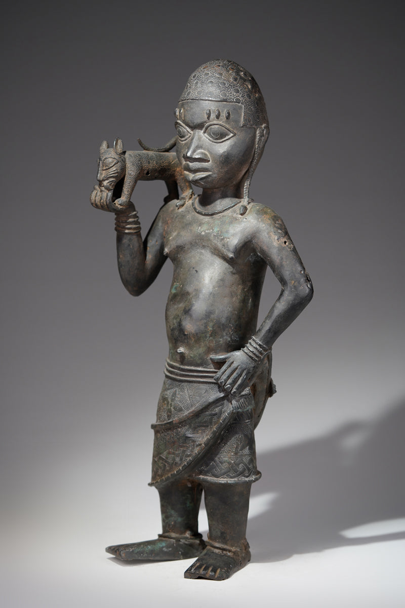 A bronze sculpture of a servant in the style of Benin