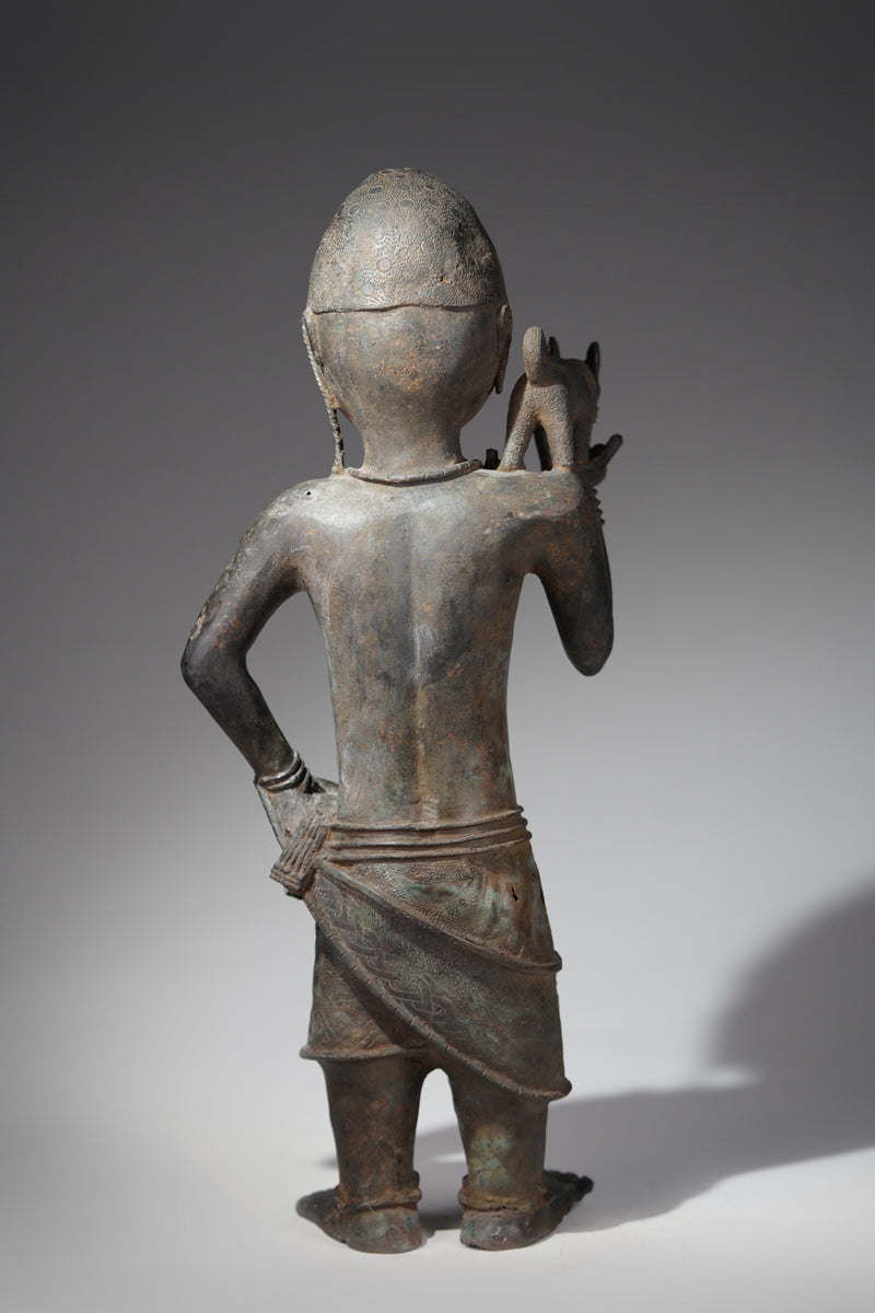 A bronze sculpture of a servant in the style of Benin