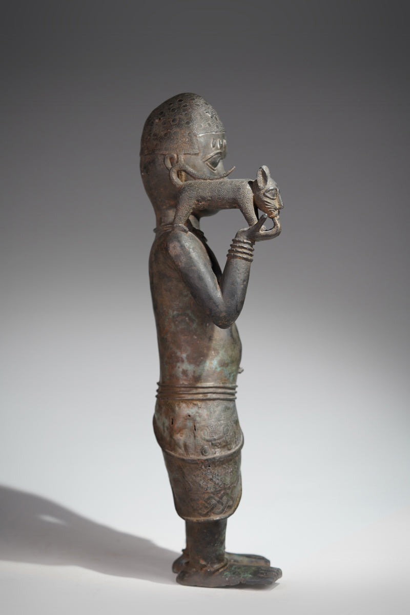 A bronze sculpture of a servant in the style of Benin