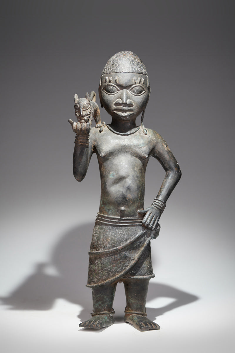 A bronze sculpture of a servant in the style of Benin