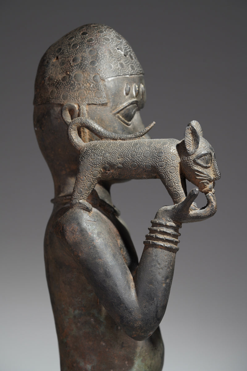 A bronze sculpture of a servant in the style of Benin