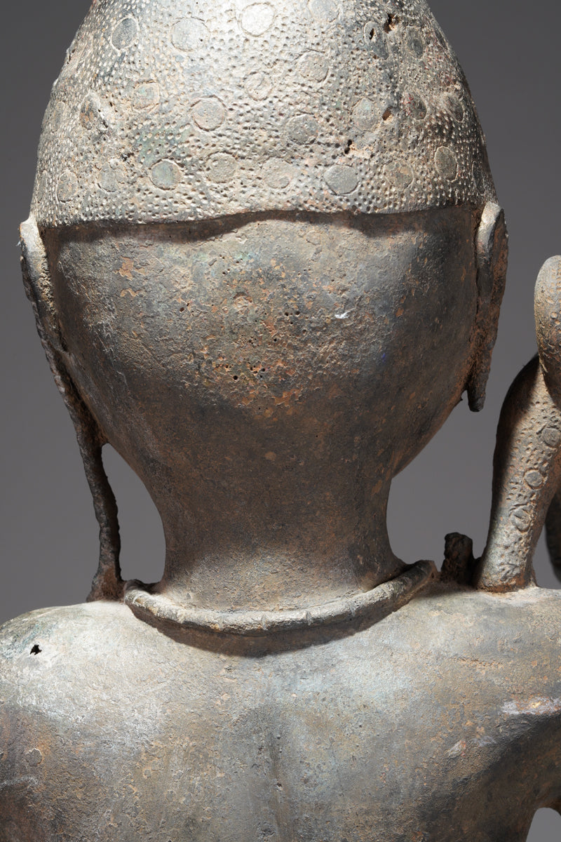 A bronze sculpture of a servant in the style of Benin