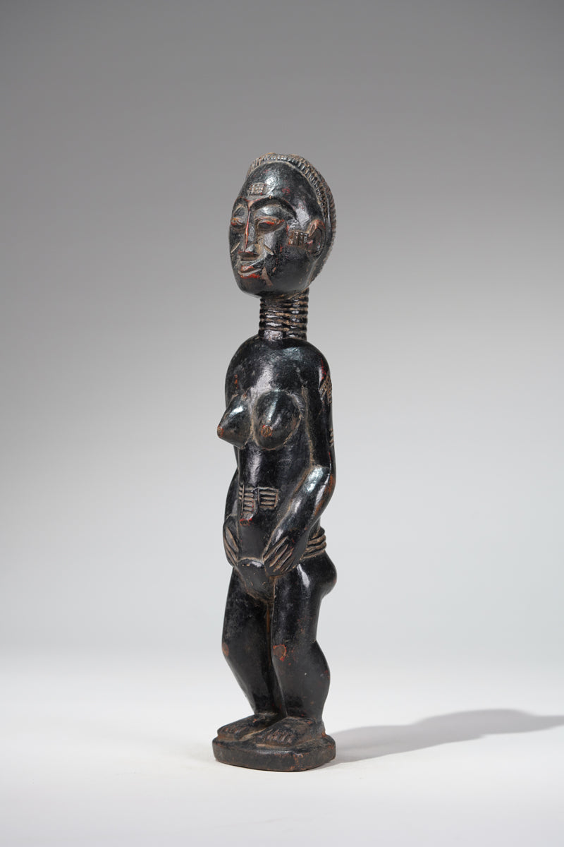 A female Baule sculpture from the Beomi region