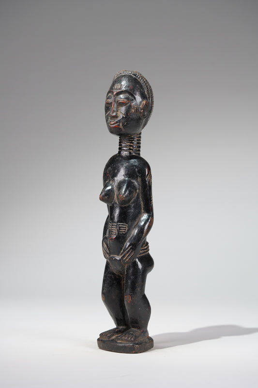 A female Baule sculpture from the Beomi region