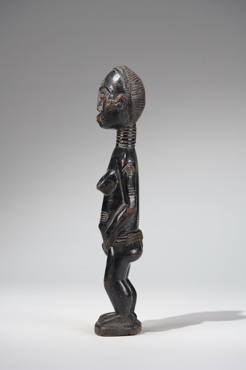 A female Baule sculpture from the Beomi region