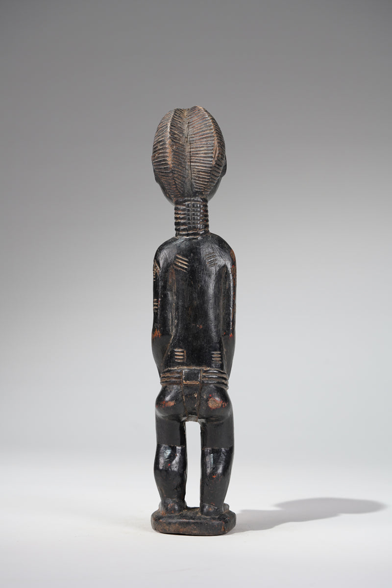 A female Baule sculpture from the Beomi region