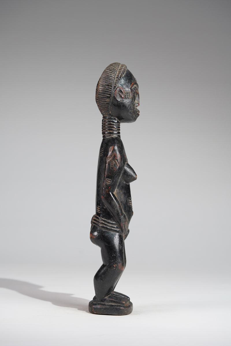 A female Baule sculpture from the Beomi region