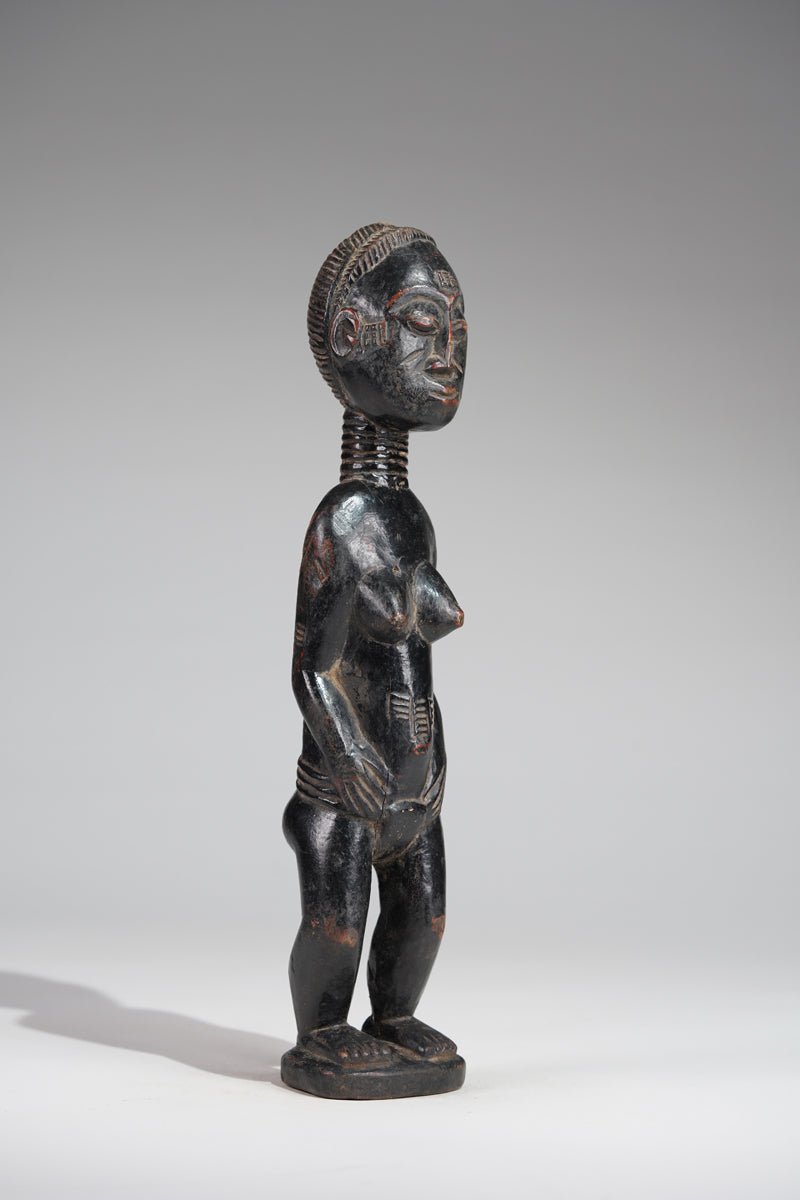 A female Baule sculpture from the Beomi region