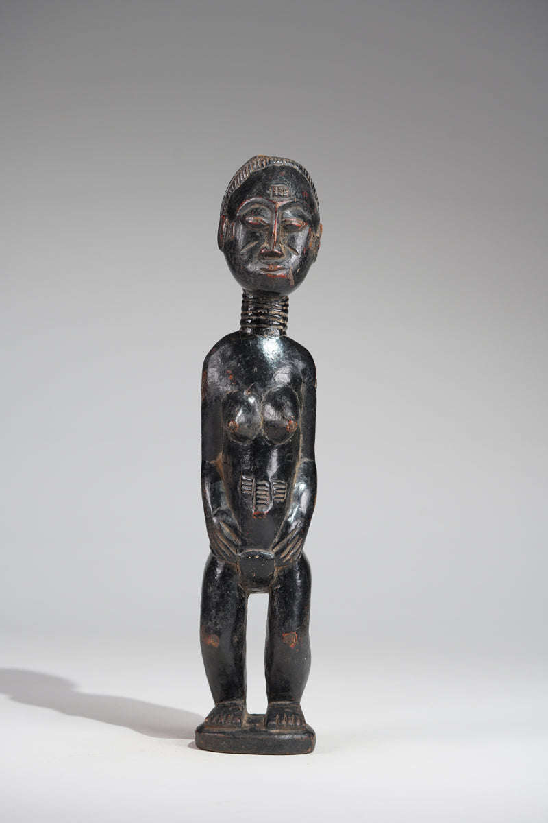 A female Baule sculpture from the Beomi region