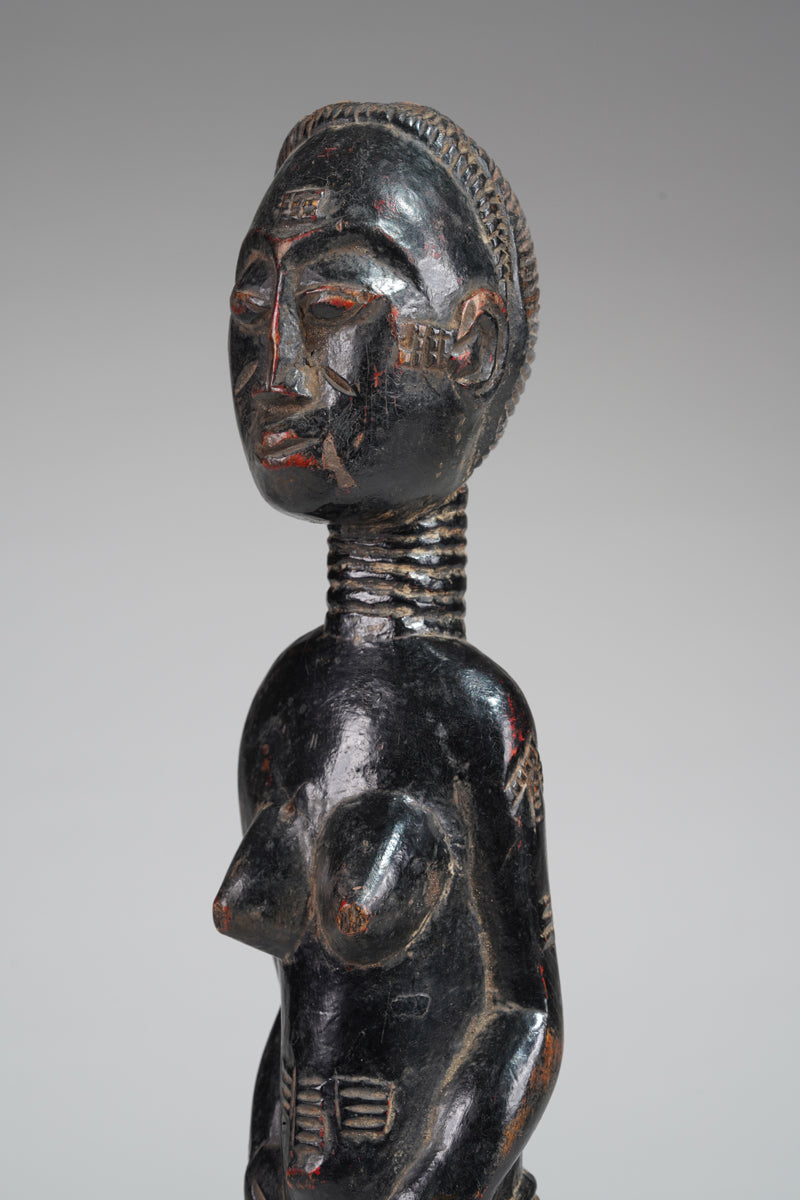 A female Baule sculpture from the Beomi region