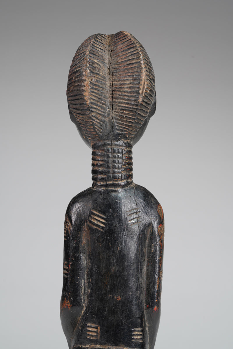 A female Baule sculpture from the Beomi region