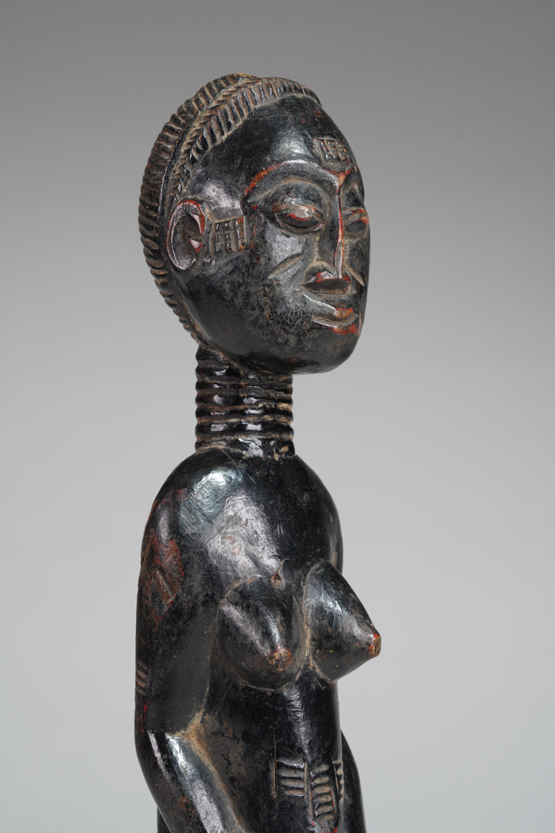 A female Baule sculpture from the Beomi region