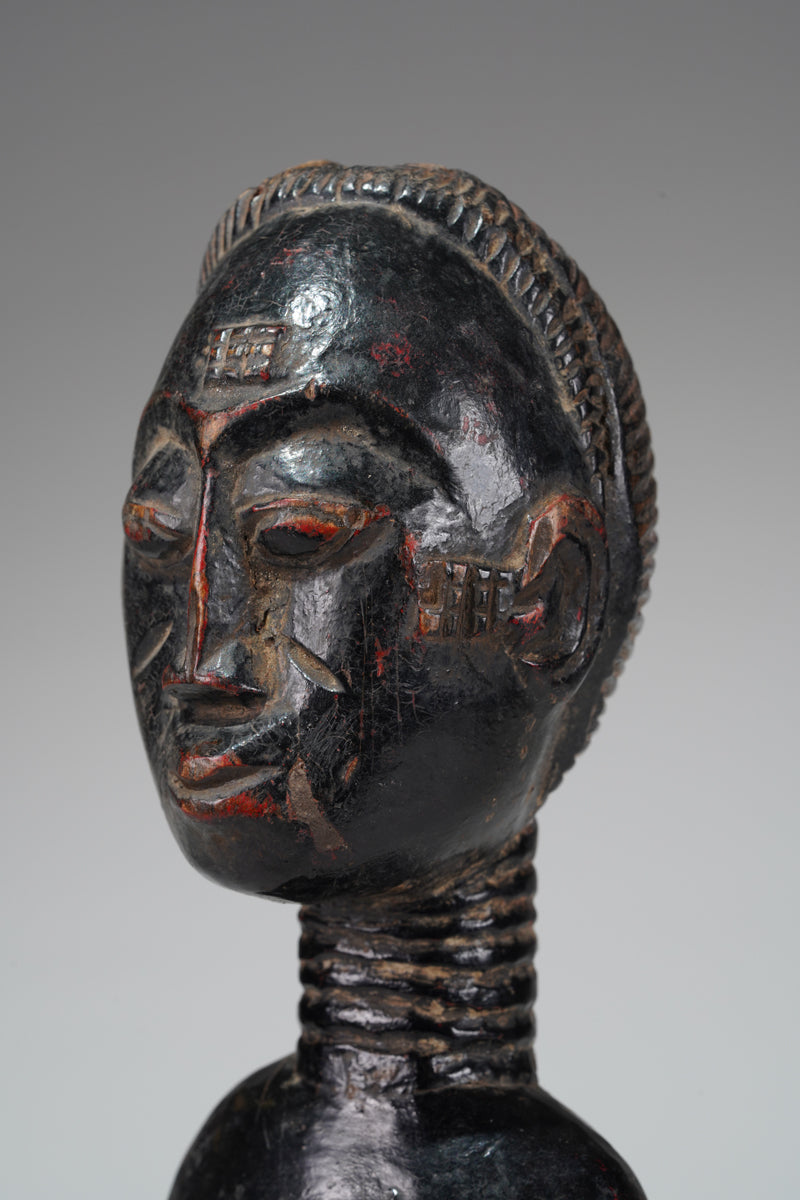 A female Baule sculpture from the Beomi region