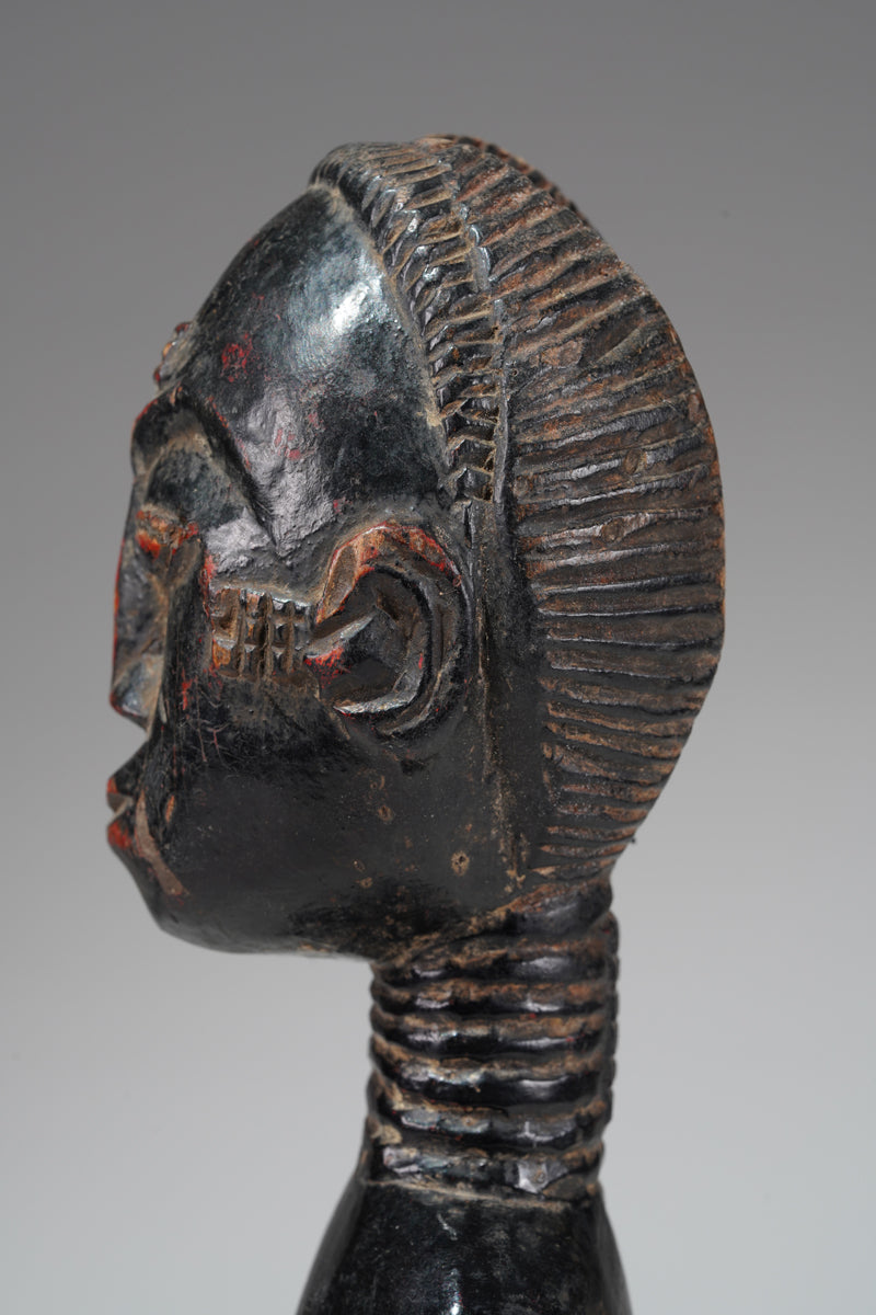 A female Baule sculpture from the Beomi region