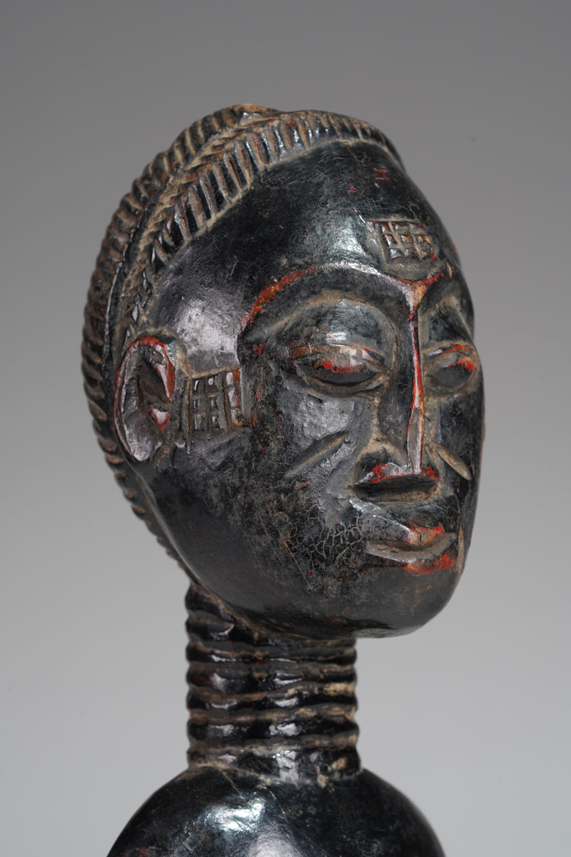 A female Baule sculpture from the Beomi region