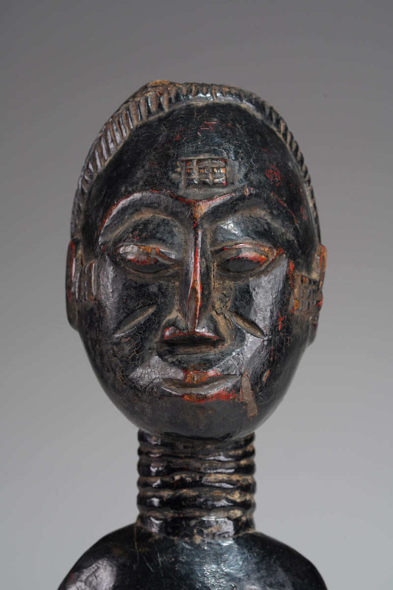 A female Baule sculpture from the Beomi region