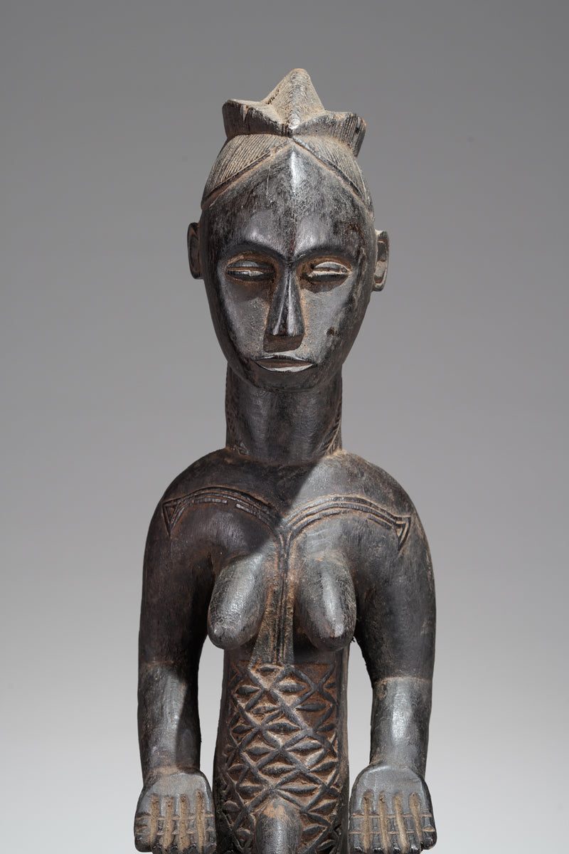 A female Bete sculpture from the Gagnoa region