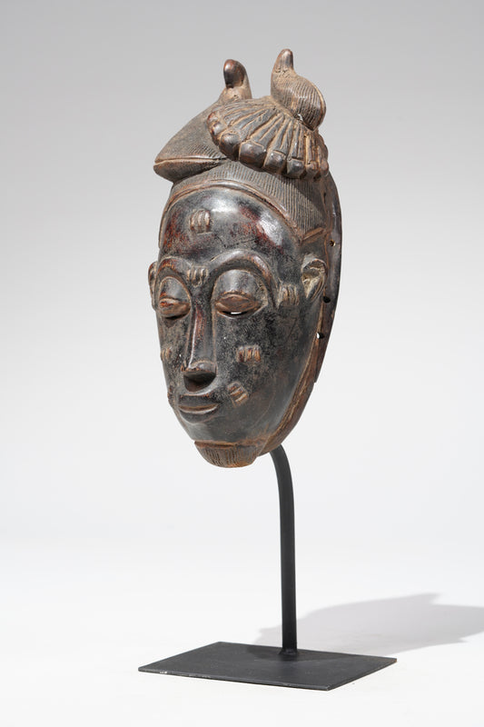 A Baule mask, collected in the Sakassou region