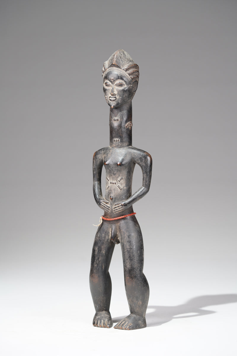 A male Baule sculpture from the Beomi region