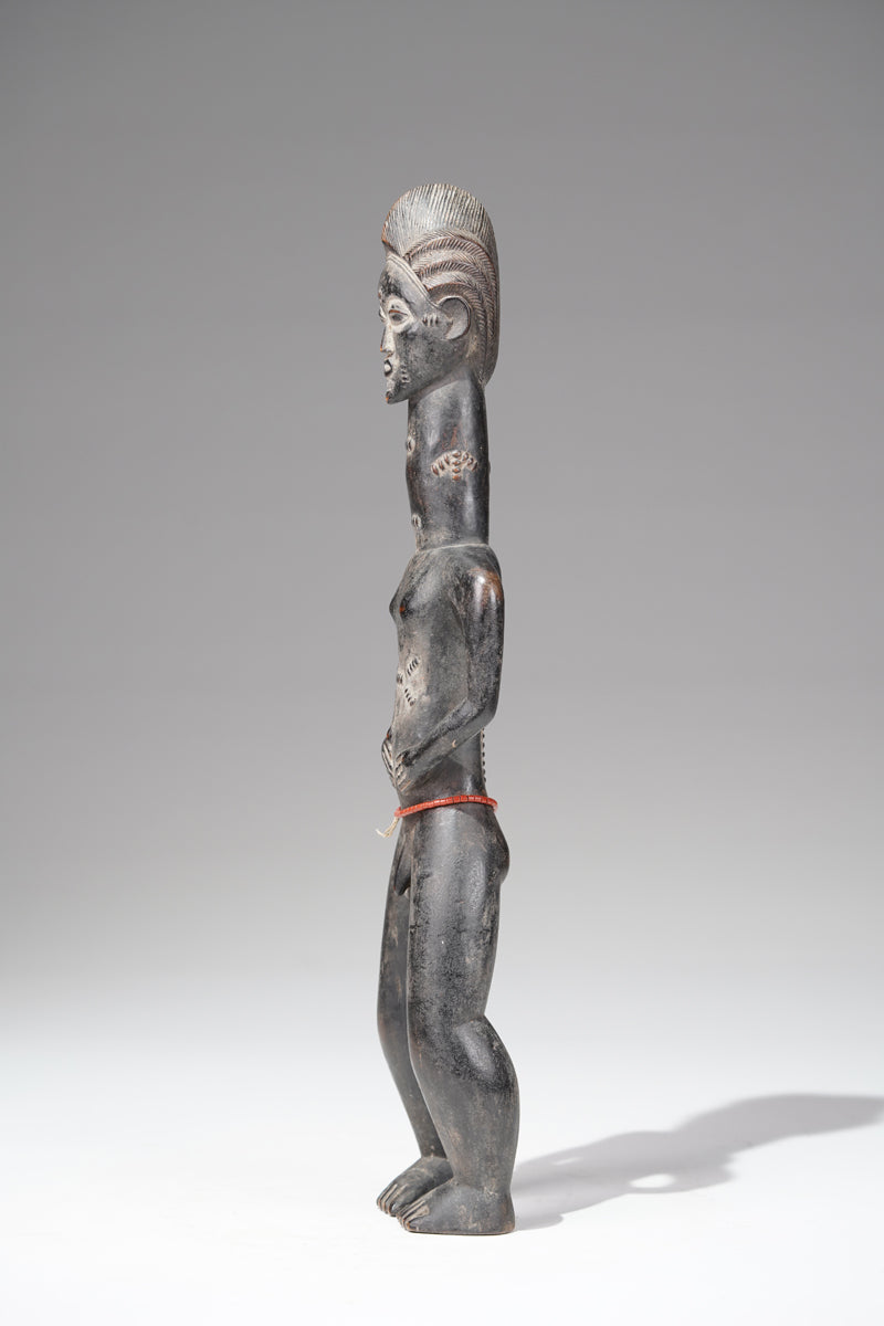 A male Baule sculpture from the Beomi region