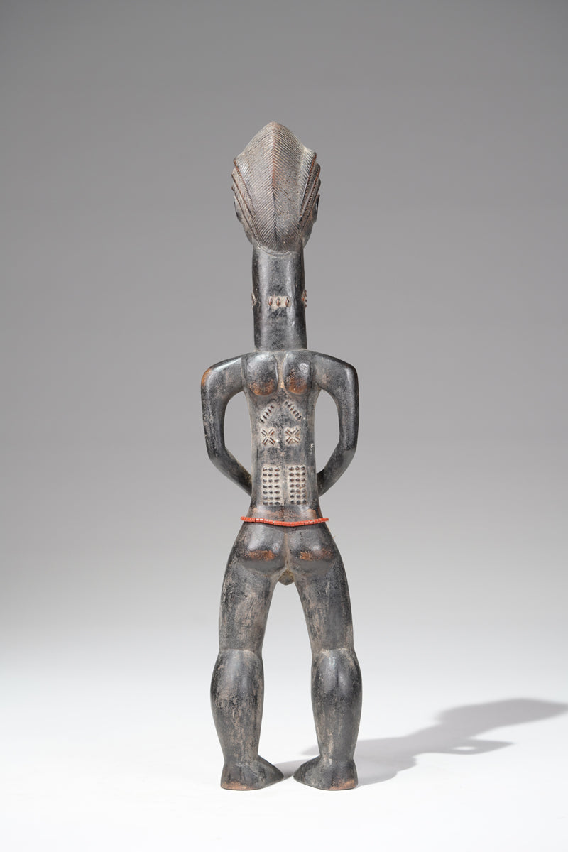 A male Baule sculpture from the Beomi region