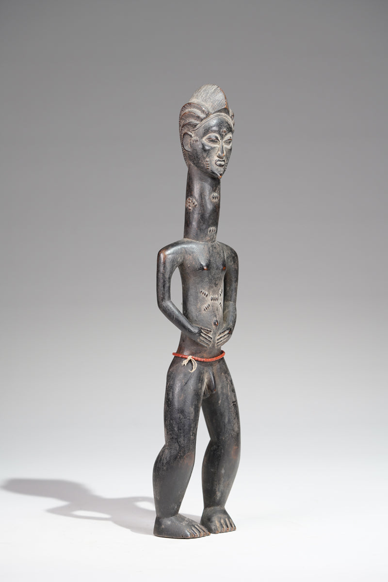 A male Baule sculpture from the Beomi region