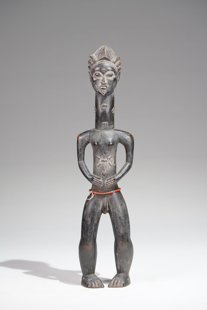 A male Baule sculpture from the Beomi region