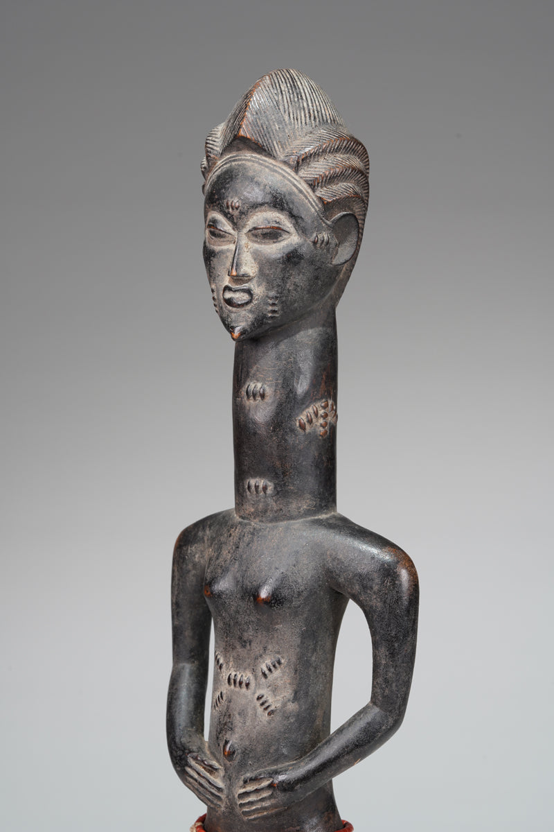 A male Baule sculpture from the Beomi region