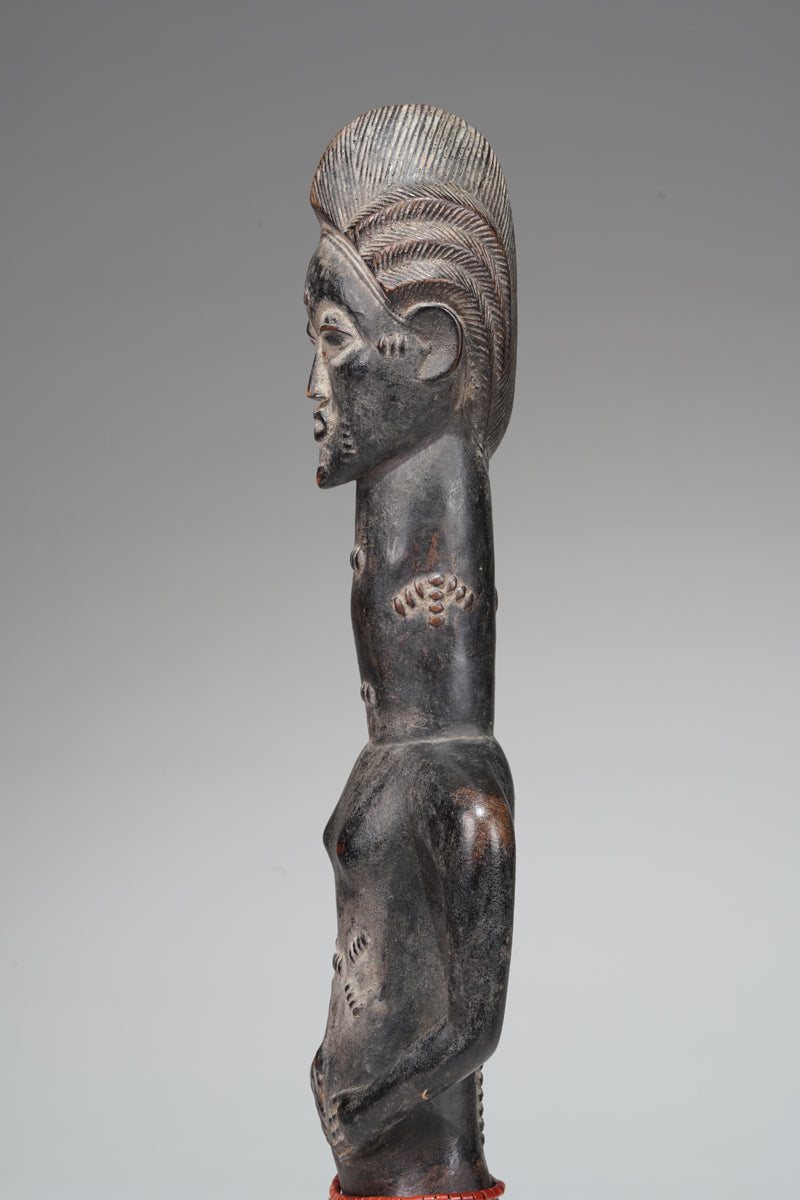 A male Baule sculpture from the Beomi region