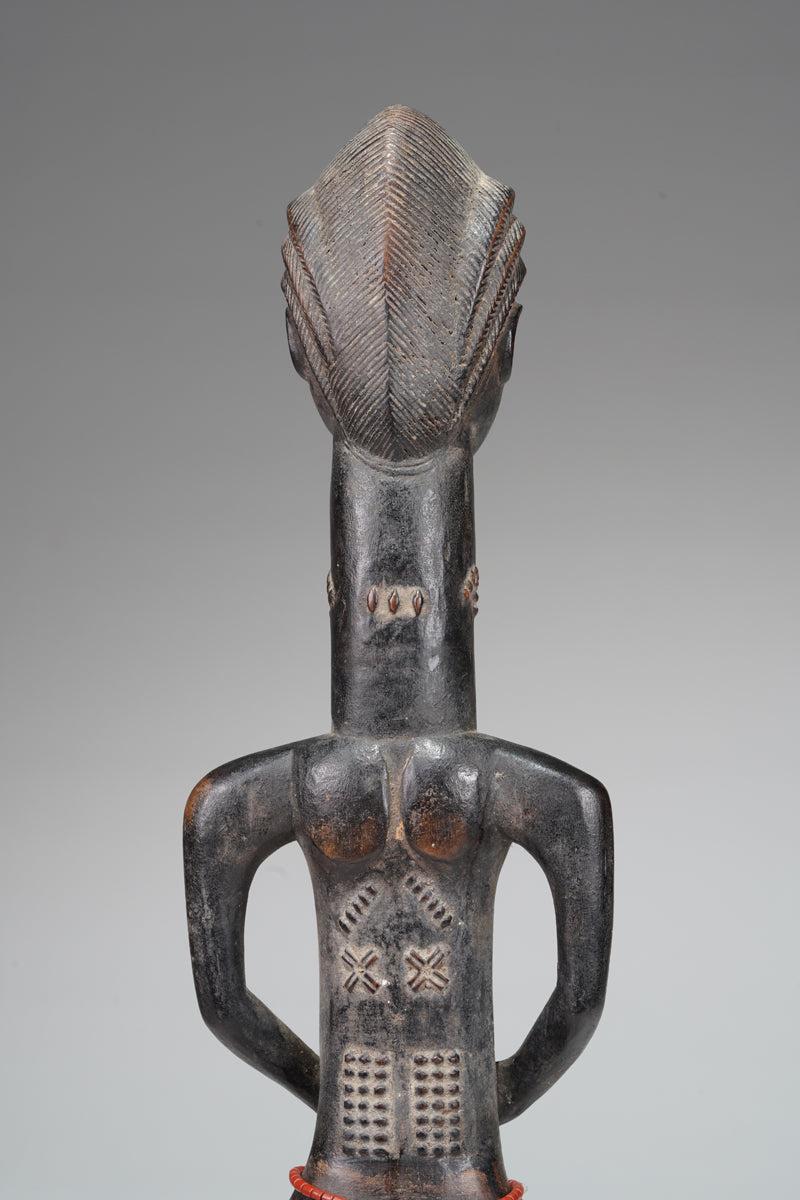 A male Baule sculpture from the Beomi region