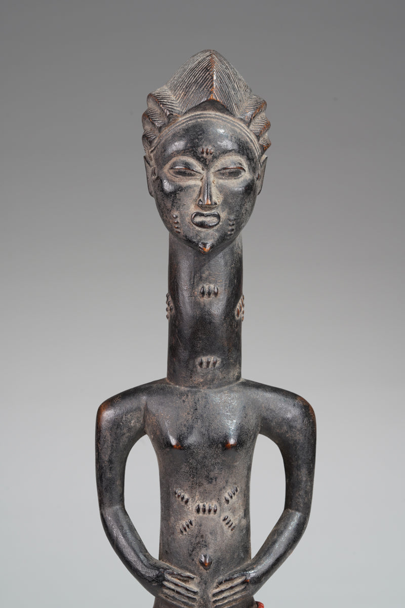 A male Baule sculpture from the Beomi region