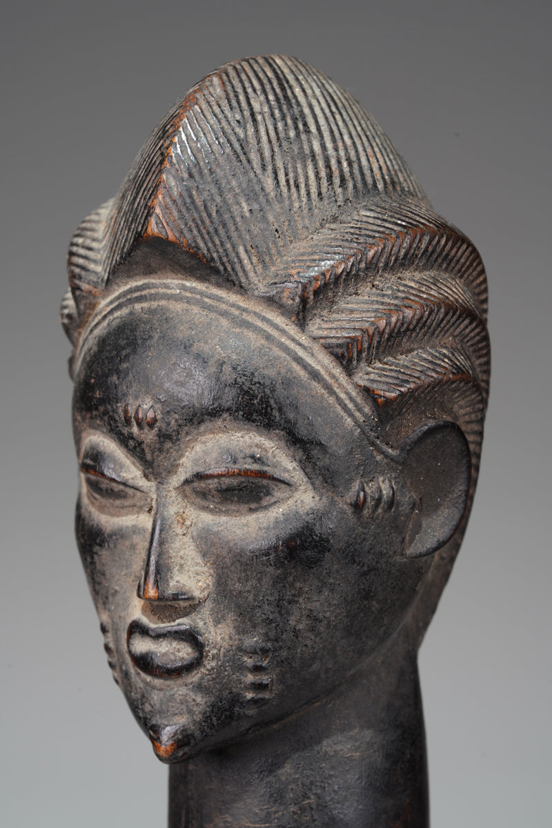 A male Baule sculpture from the Beomi region