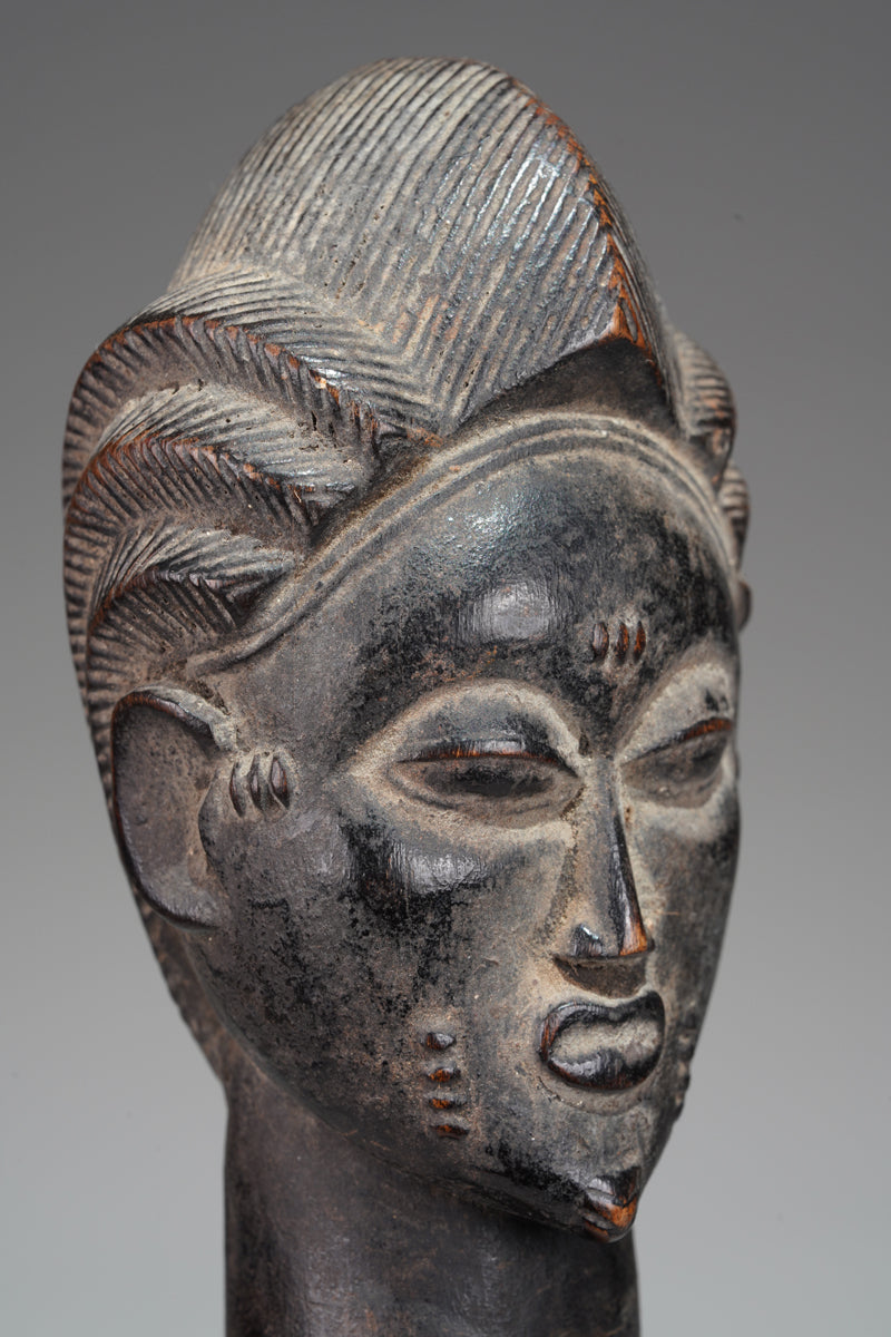 A male Baule sculpture from the Beomi region