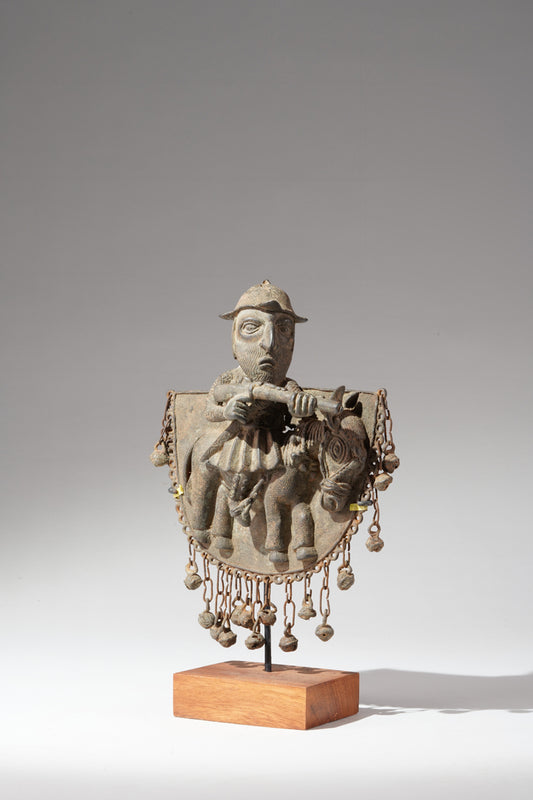 A Portuguese, riding on a horse with a muskete in its hand