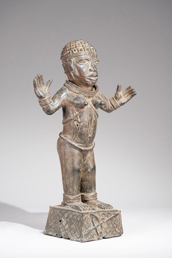 A female Bronze sculpture, in the style of Benin