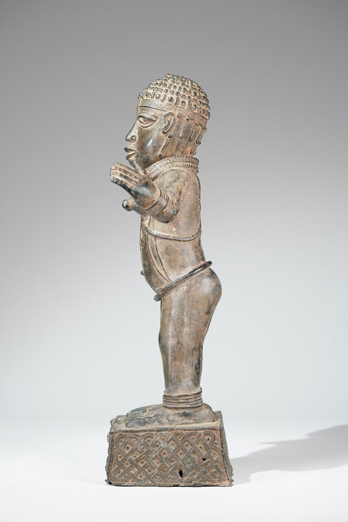 A female Bronze sculpture, in the style of Benin