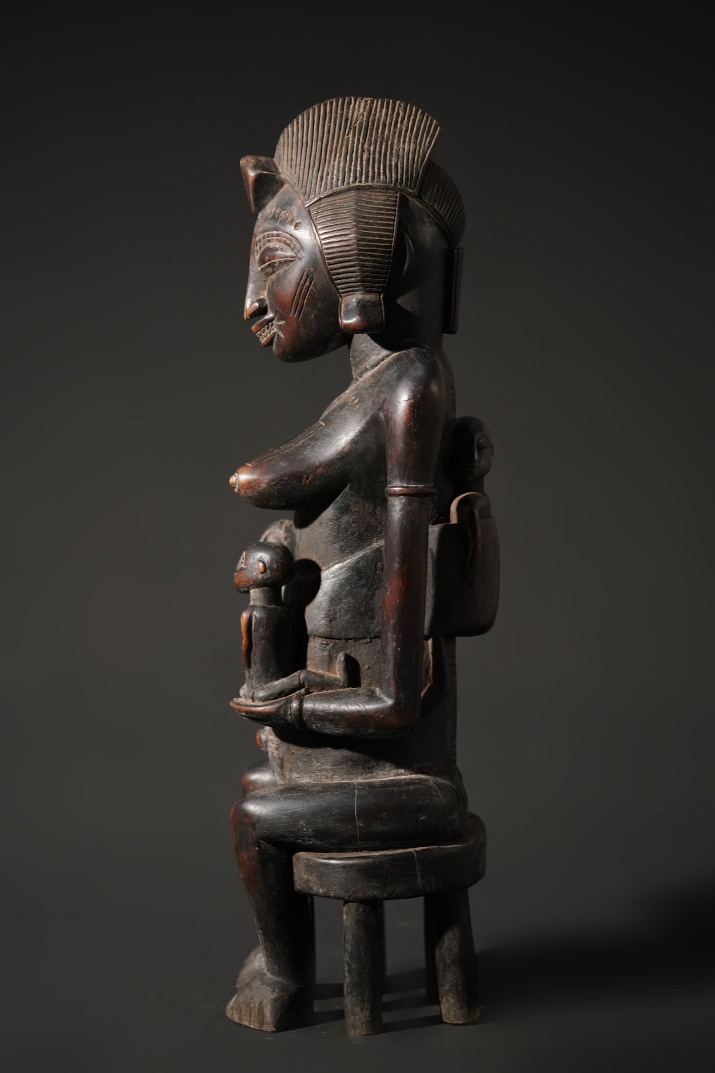 A remarkable seated Senufo maternity