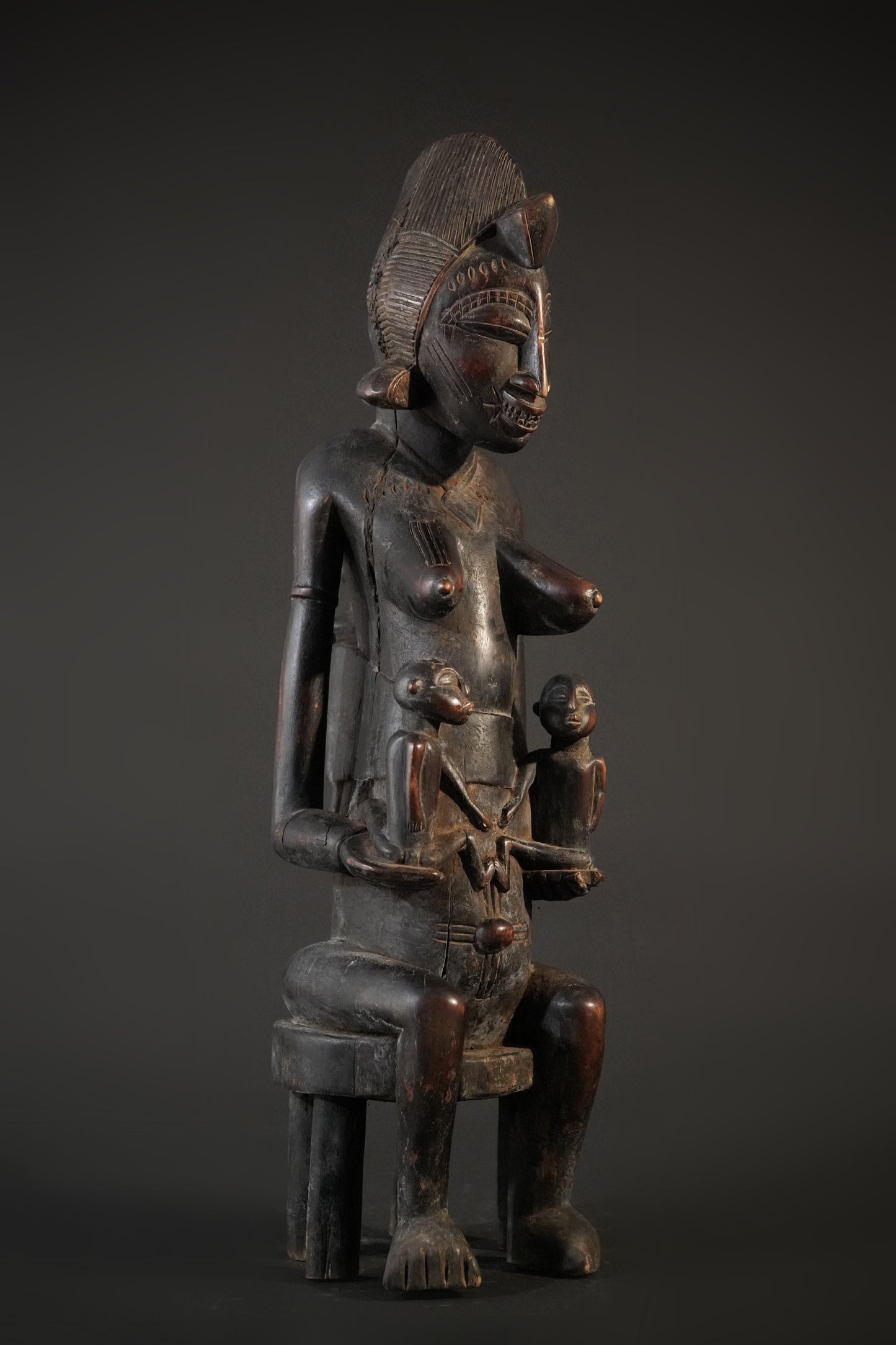 A remarkable seated Senufo maternity