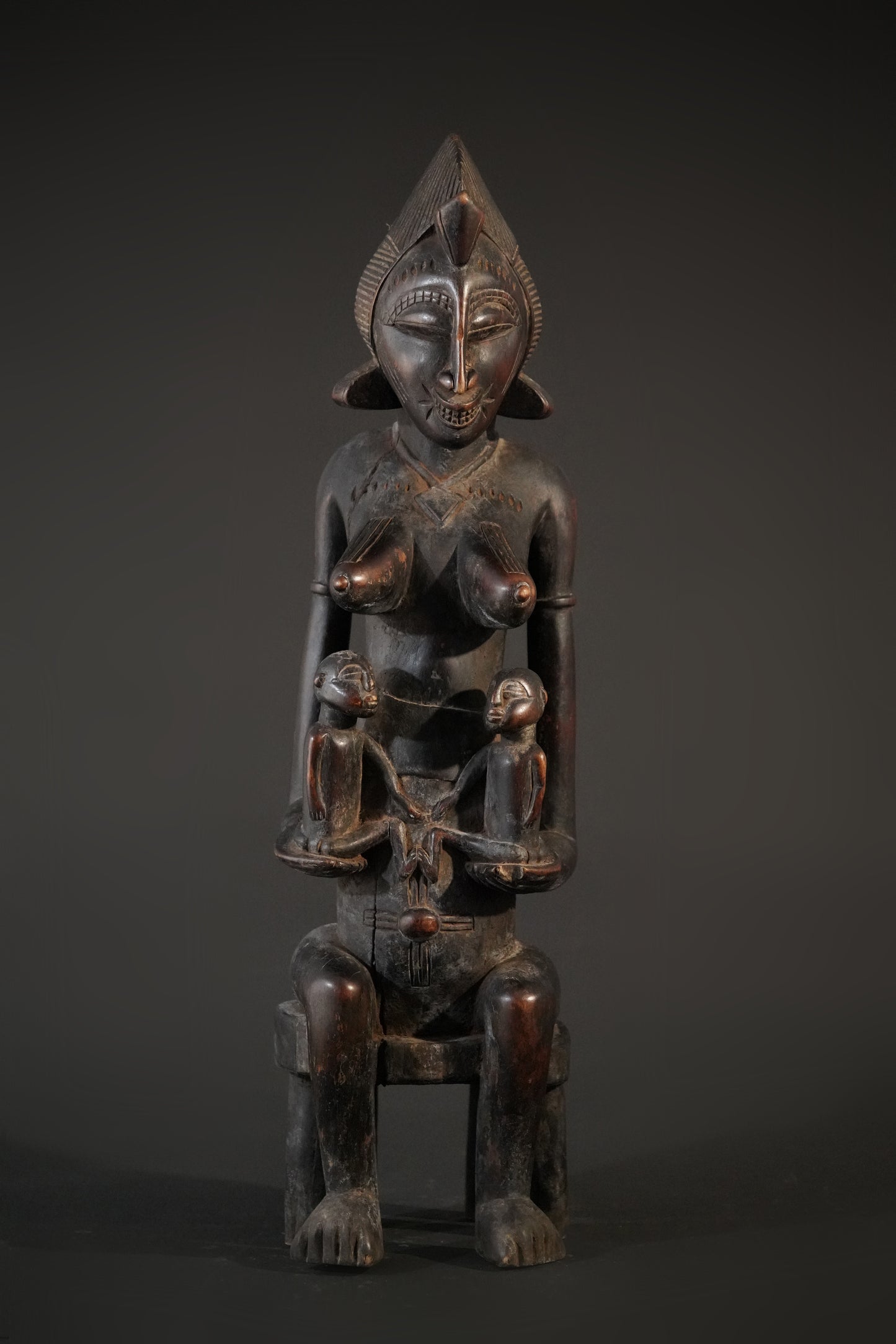 A remarkable seated Senufo maternity