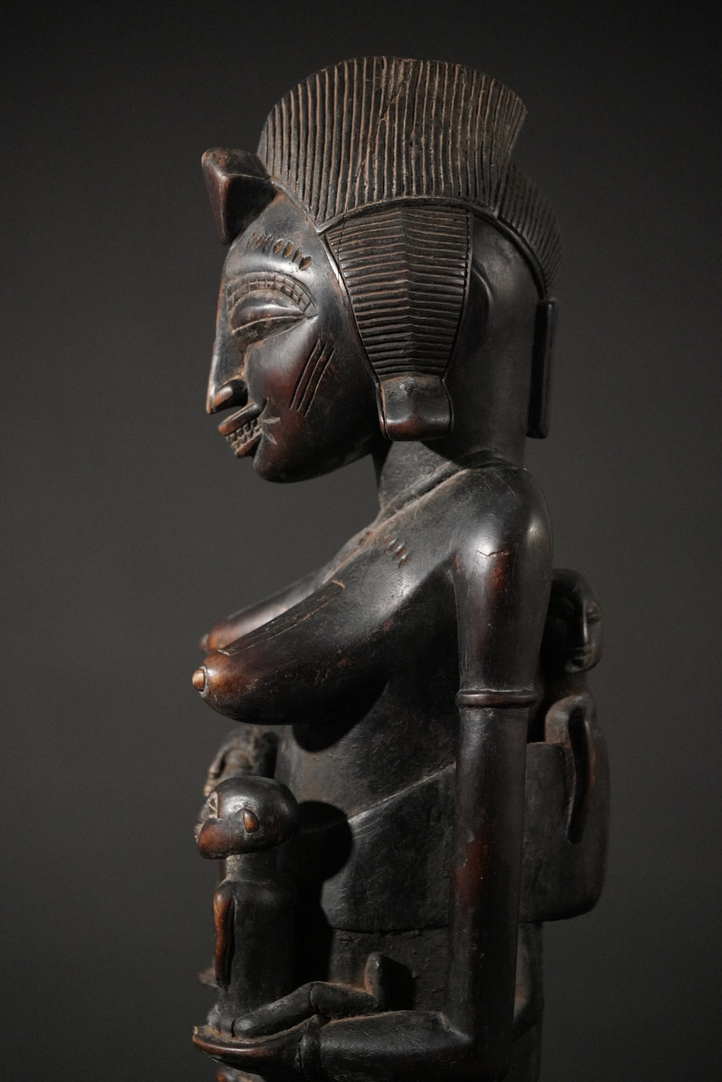 A remarkable seated Senufo maternity