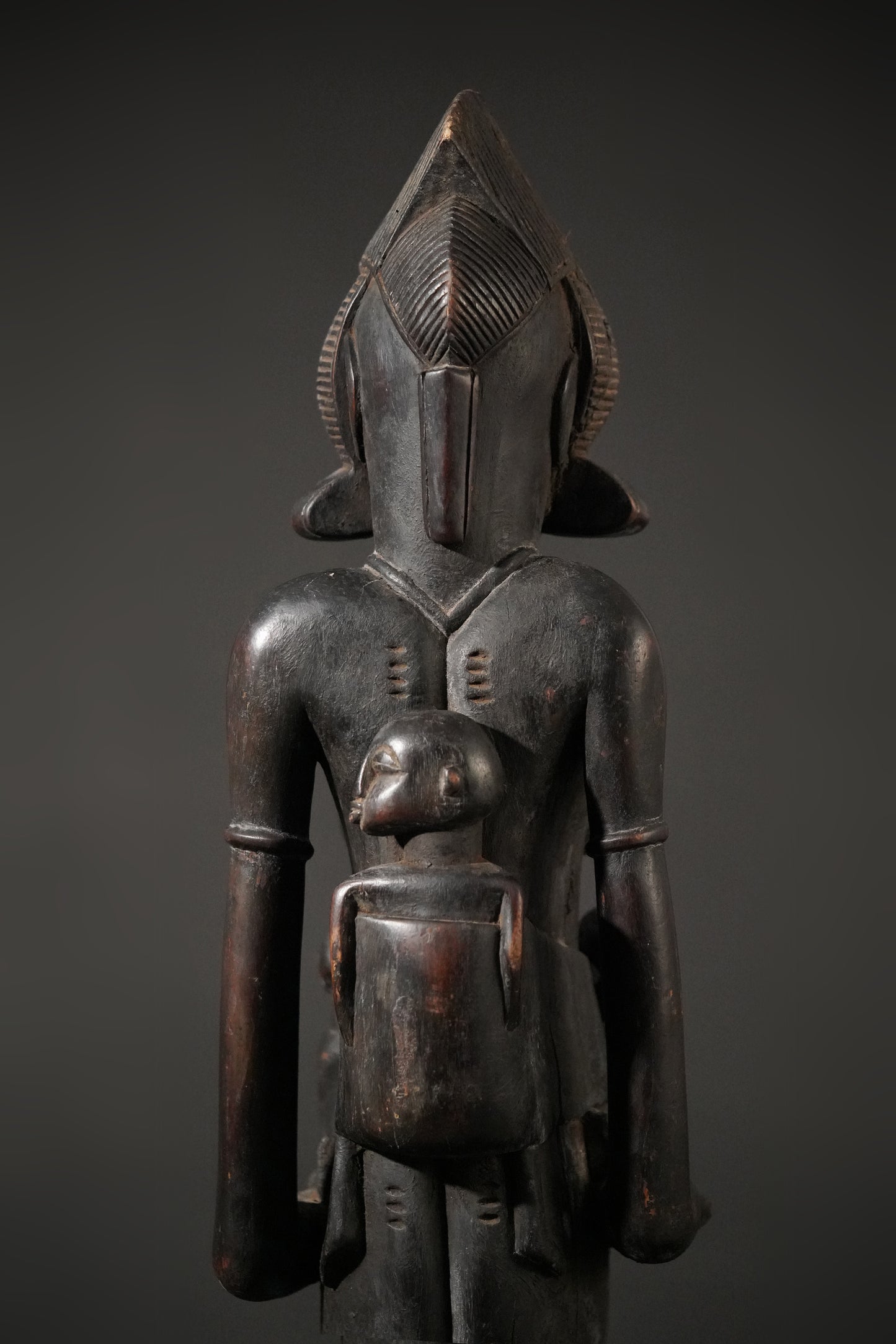 A remarkable seated Senufo maternity